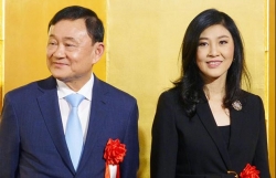 thai lan tim cach dan do cuu thu tuong thaksin tu hong kong